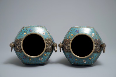 A pair of Chinese cloisonn&eacute; vases with floral design and ring handles, 19th C.
