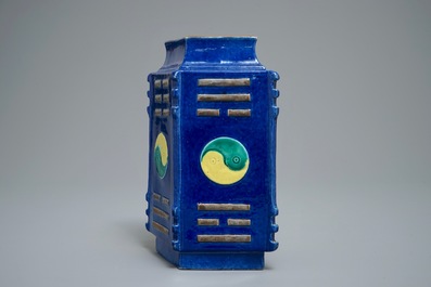 A Chinese blue-ground lozenge-shaped cong vase with taoist symbols, 19th C.