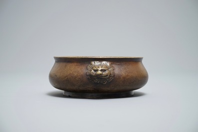 A Chinese bronze censer on wooden stand, Xuande mark, 18th C.