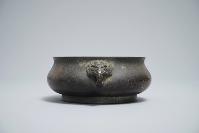 A Chinese bronze incense burner with elephant head handles, qianqing gongbao mark, Ming