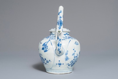 A Chinese blue and white wine jug and cover with fine design of birds and prunus branches, Transitional period