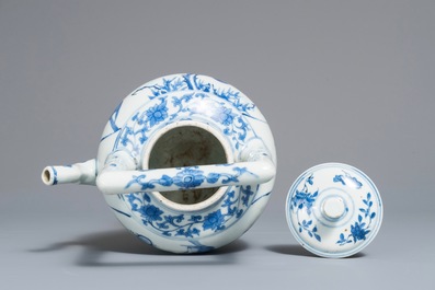 A Chinese blue and white wine jug and cover with fine design of birds and prunus branches, Transitional period