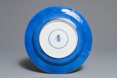A Chinese powder blue and gilt dish with a flowervase, Kangxi