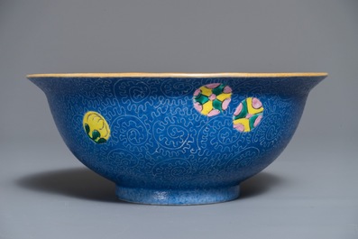 A Chinese famille rose blue ground sgraffiato bowl, Qianlong mark, 19th C.