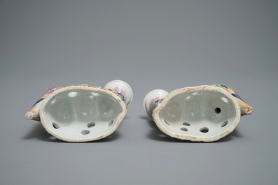 A pair of Chinese famille rose candle holders shaped as birds on a rock, Jiaqing