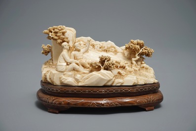 A Chinese carved ivory group of a two shepherds with their flock, 1st half 20th C.