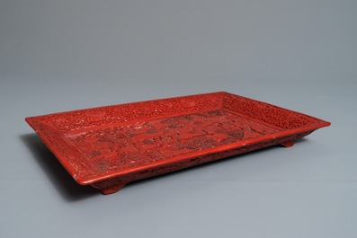 A rectangular Chinese cinnabar lacquer tray with figures in a landscape, 18/19th C.