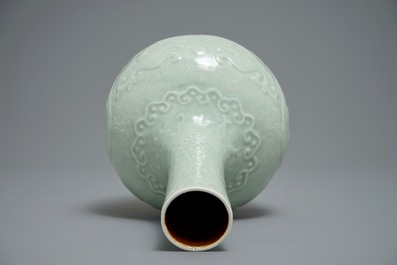 A Chinese bottle-shaped celadon vase with applied design, Qianlong mark, 19/20th C.