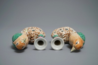 A pair of Chinese famille rose candle holders shaped as birds on a rock, Jiaqing