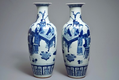 A pair of Chinese blue and white vases with ladies at a table, 19th C.