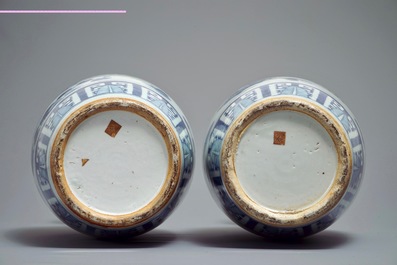 A pair of Chinese blue and white vases with ladies at a table, 19th C.