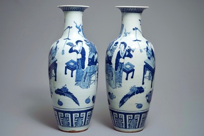 A pair of Chinese blue and white vases with ladies at a table, 19th C.