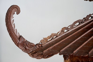 A richly carved Chinese pagoda-shaped display case, ca. 1900