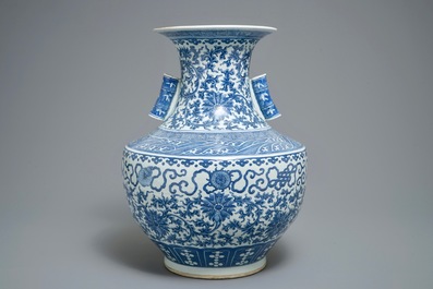 A Chinese blue and white lotus scroll hu vase, 19th C.