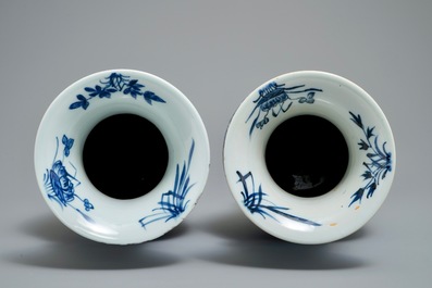 A pair of Chinese blue and white flower scroll vases, 19th C.