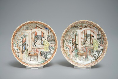 A pair of fine Chinese famille rose cups and saucers with figures in a garden, Yongzheng/Qianlong