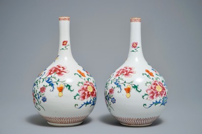 A pair of Chinese famille rose bottle vases with floral design, Qianlong
