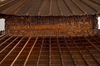 A richly carved Chinese pagoda-shaped display case, ca. 1900