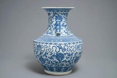 A Chinese blue and white lotus scroll hu vase, 19th C.