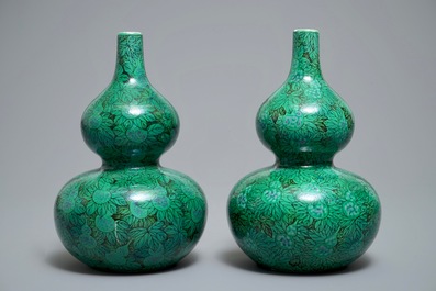 A pair of Chinese double gourd green-ground vases with squash fruit and vines, Republic, 20th C.