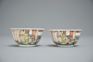 A pair of fine Chinese famille rose cups and saucers with figures in a garden, Yongzheng/Qianlong