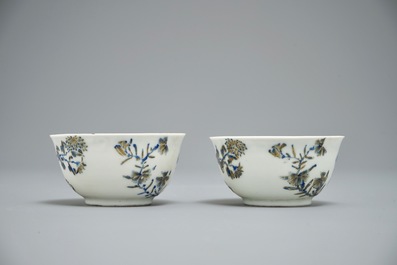 A pair of Chinese eggshell cups and saucers with overglaze blue and gilt floral design, Yongzheng