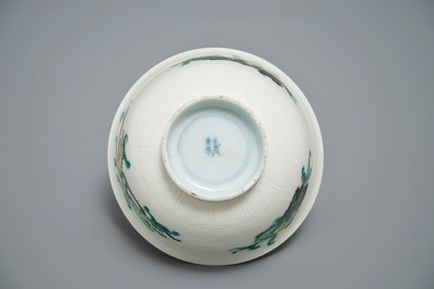 Three Chinese plates with dragons and phoenixes and an underglaze decorated bowl, Kangxi and Guangxu marks, 19/20th C.