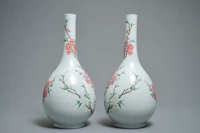 A pair of large Chinese famille rose bottle vases with floral design, 19/20th C.