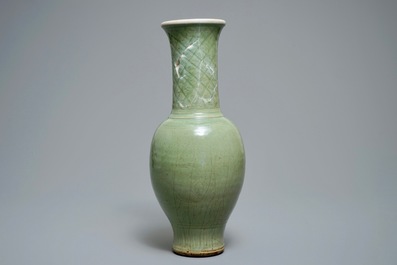 A tall Chinese Longquan celadon vase with underglaze design, Song or Ming