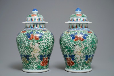 A pair of Chinese wucai vases and covers, Chenghua mark, 19/20th C.