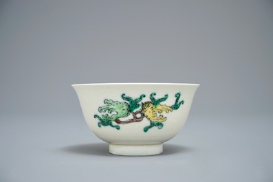 Three Chinese plates with dragons and phoenixes and an underglaze decorated bowl, Kangxi and Guangxu marks, 19/20th C.