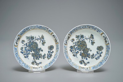 A pair of Chinese eggshell cups and saucers with overglaze blue and gilt floral design, Yongzheng