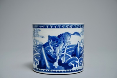 A Chinese blue and white cylindrical brush pot or bitong with mythical beasts, Kangxi