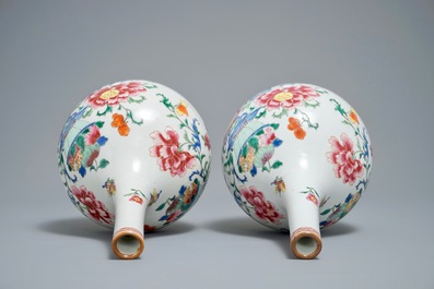A pair of Chinese famille rose bottle vases with floral design, Qianlong