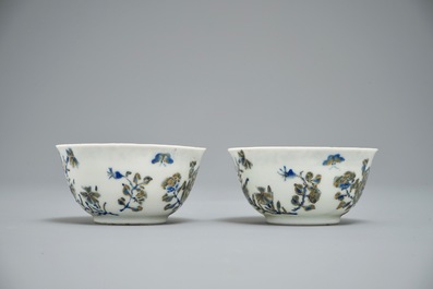 A pair of Chinese eggshell cups and saucers with overglaze blue and gilt floral design, Yongzheng