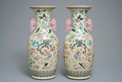 A pair of Chinese famille rose cream-ground butterfly vases, 19th C.