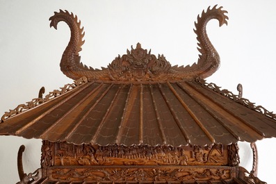 A richly carved Chinese pagoda-shaped display case, ca. 1900