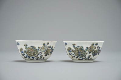 A pair of Chinese eggshell cups and saucers with overglaze blue and gilt floral design, Yongzheng