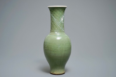 A tall Chinese Longquan celadon vase with underglaze design, Song or Ming