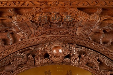 A richly carved Chinese pagoda-shaped display case, ca. 1900