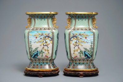 A pair of Chinese parcel-gilt cloisonn&eacute; vases on wooden stands, 1st half 20th C.