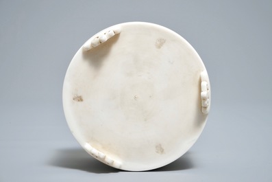 A Chinese cylindrical blanc de Chine Dehua censer on ruyi feet, 19/20th C.