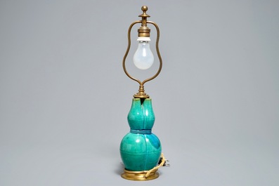 A Chinese turquoise-glazed three-spouted vase with bronze lamp mounts, 19th C.