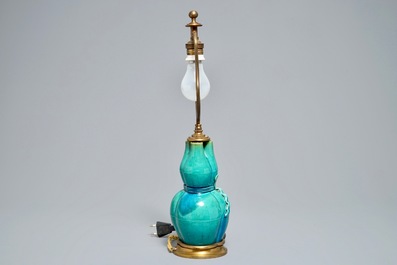 A Chinese turquoise-glazed three-spouted vase with bronze lamp mounts, 19th C.