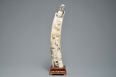 A tall Chinese carved ivory figure of a lady, 2nd half 19th C.