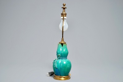 A Chinese turquoise-glazed three-spouted vase with bronze lamp mounts, 19th C.