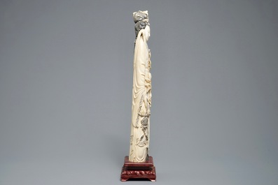 A tall Chinese carved ivory figure of a lady, 2nd half 19th C.