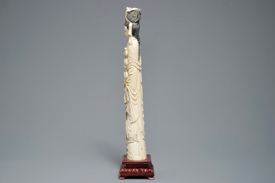 A tall Chinese carved ivory figure of a lady, 2nd half 19th C.