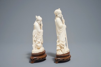 Two Chinese carved ivory figures of sages on wooden stands, 1st half 20th C.