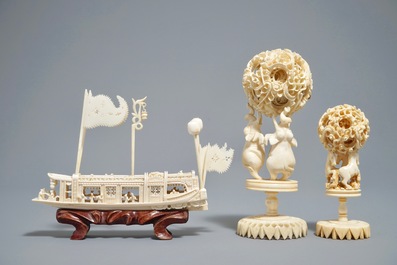 A Chinese carved ivory model of a junk and two Canton puzzle balls, 19/20th C.